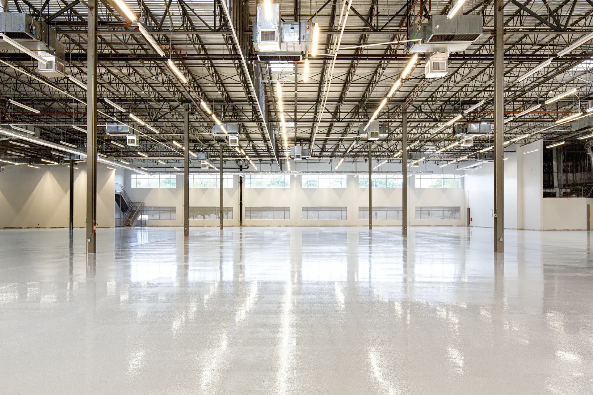 A seamless polished industrial floor running between machining cells