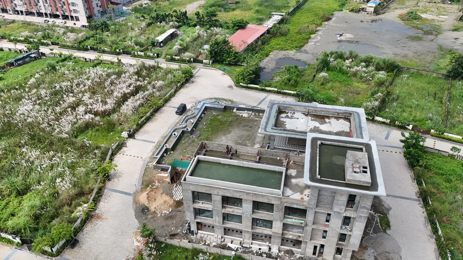 Aerial drone view of Club House Subham Arohan construction progress at Dharapur
