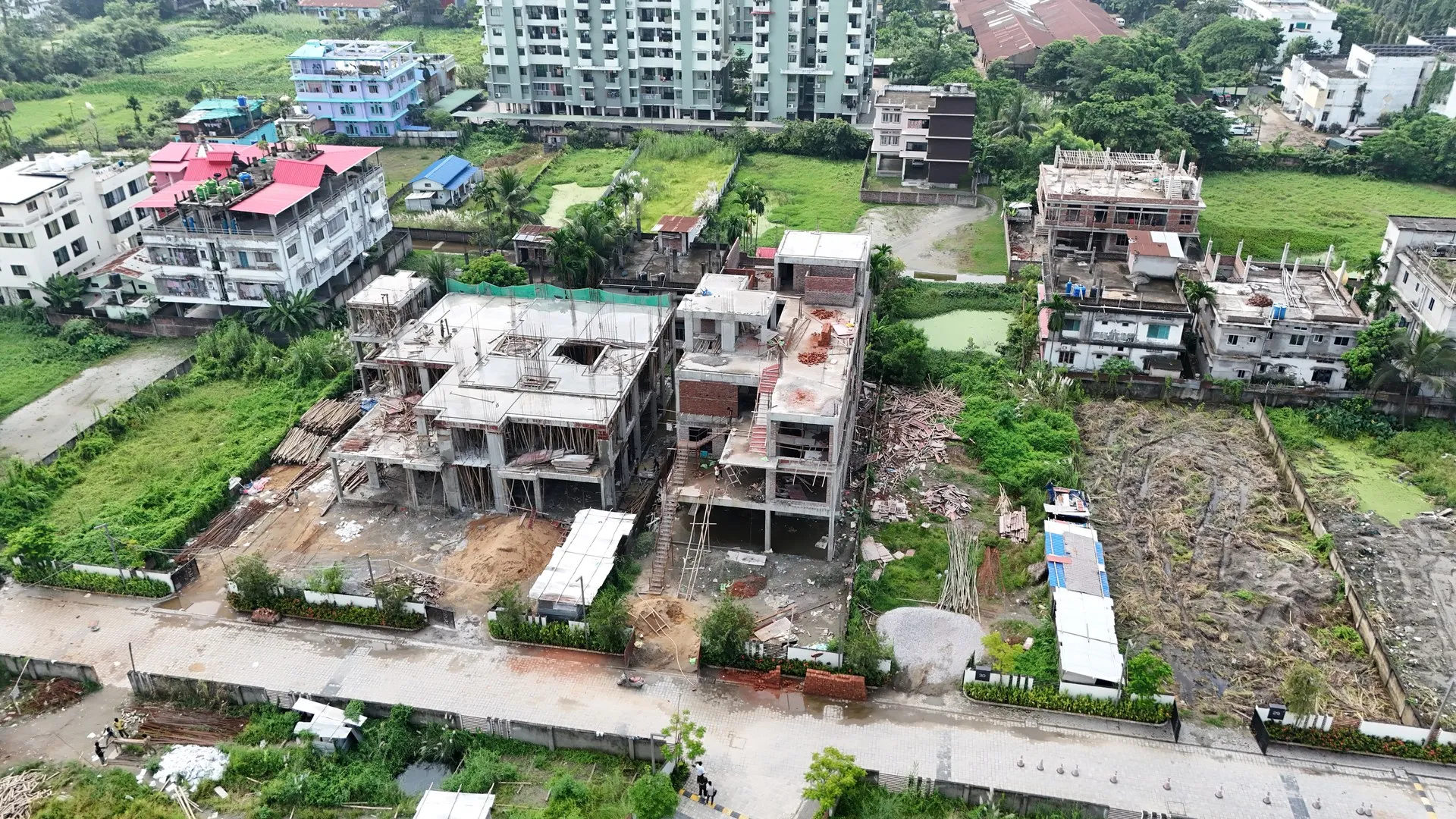 Aerial drone footage of Deepok Bajoria duplex building construction at Dharapur