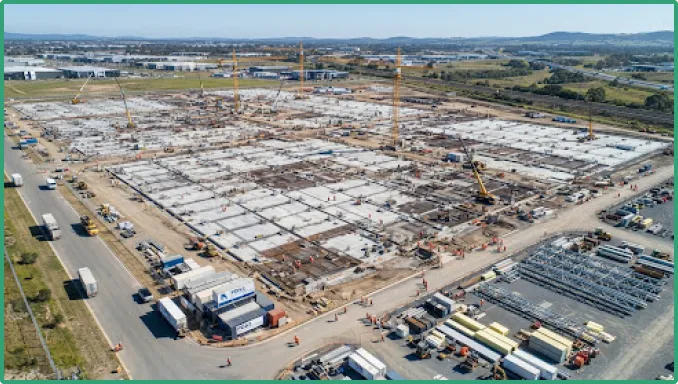 A long warehouse structure under construction